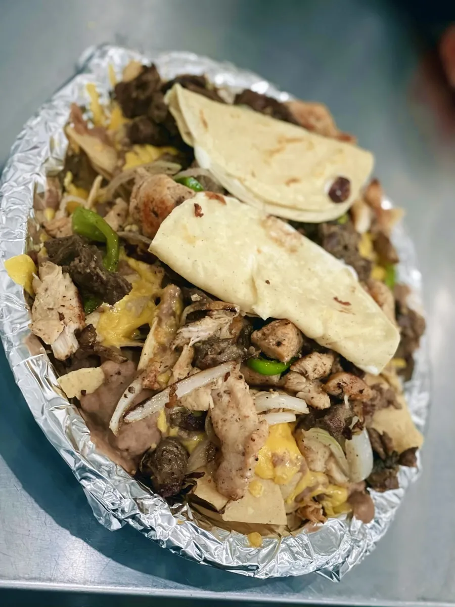 Botana mixta for two with chips, beans, cheese, chicken and beef fajita from Loredo's Tortilleria
