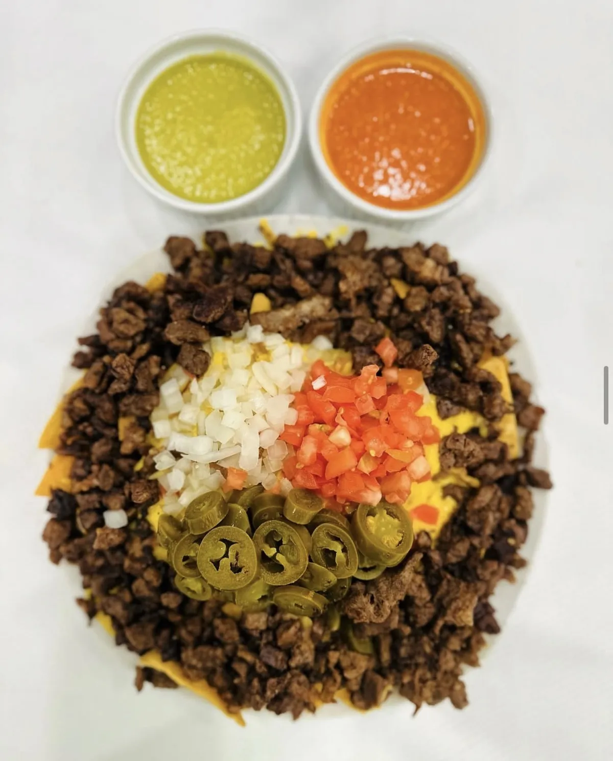 Friday special panchos with chips, beans, cheese and toppings from Loredo's Tortilleria